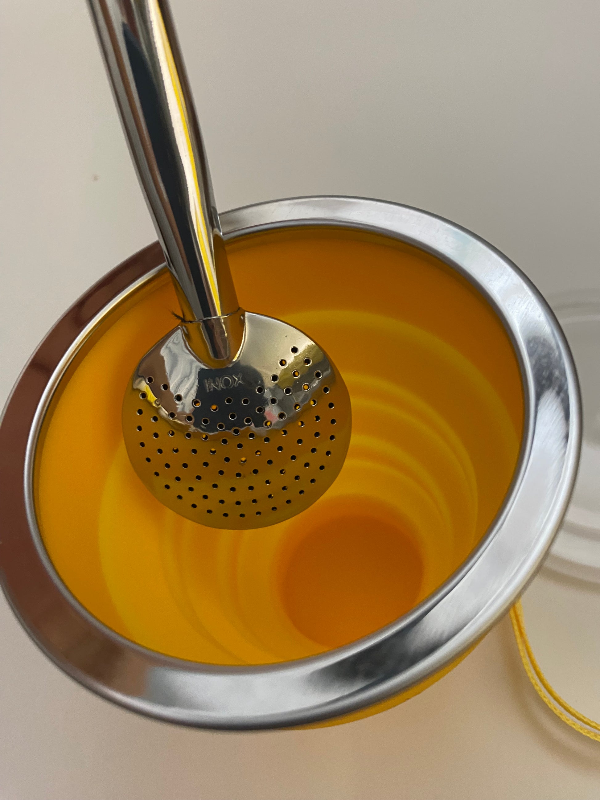 Top of a mate gourd with metal rim and a bombilla