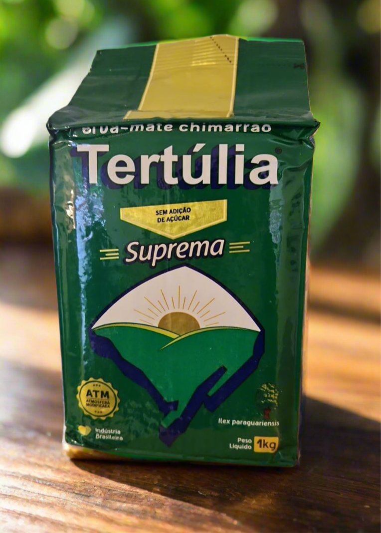 A green package of Tertulia Suprema Chimarrão mate tea with a label featuring a blue and yellow design and the weight of 1kg indicated.
