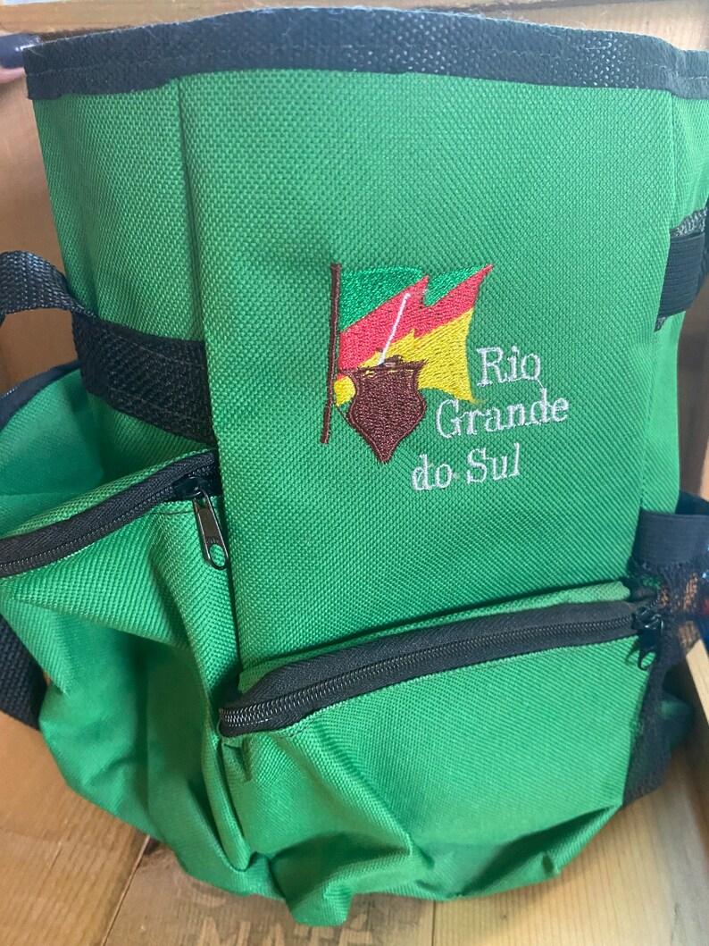 A green matera carrying case written on it "Rio Grande do Sul" 