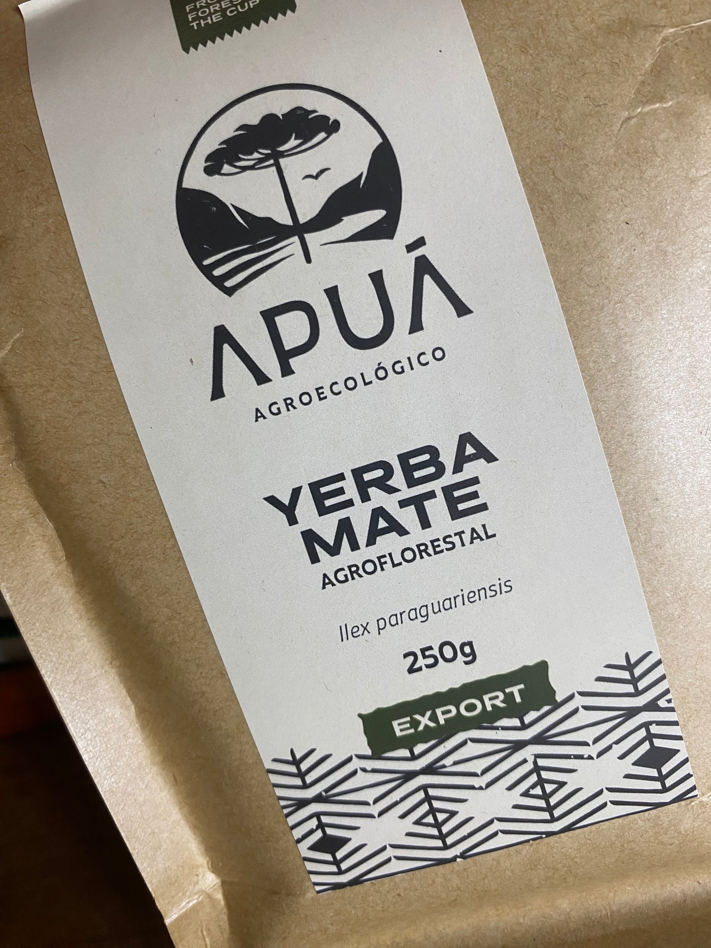 Yerba Mate package with branding and product details on a brown background