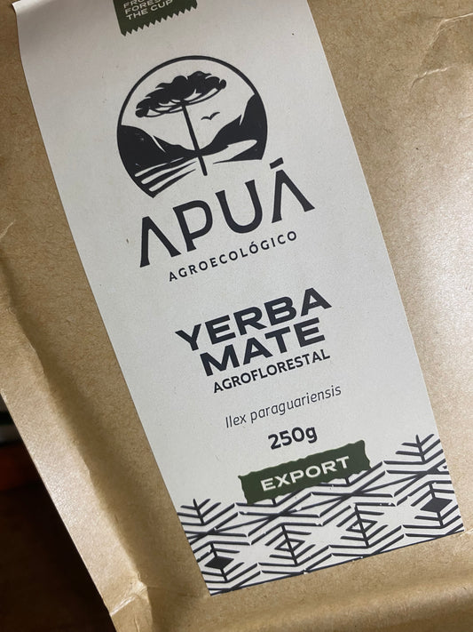 Yerba Mate package with branding and product details on a brown background