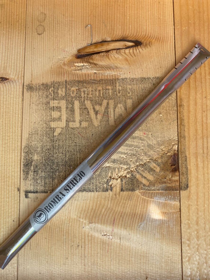 Bombilla agianst a wooden crate backdrop.